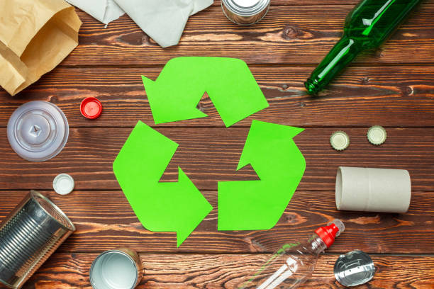 istock Eco concept with recycling symbol on table background top view 1144371924