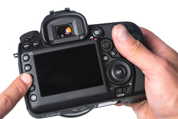 istock Photo camera in hand isolated on white background 1144372195