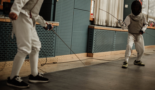 Young people fencing