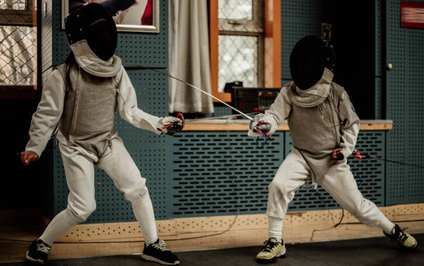 istock Young people fencing 1144373506