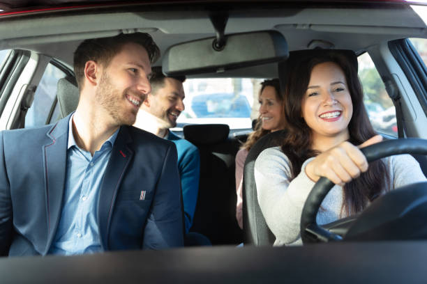 Smiling People Sitting In Car Group Of Happy Friends Having Fun In The Car carsharing photos stock pictures, royalty-free photos & images