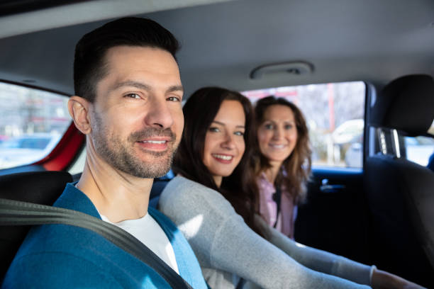 istock Smiling People Sitting In Car 1144373565