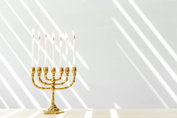 istock Bronze Hanukkah menorah with burning candles 1144373580