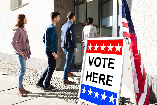 Group Of Young People Standing At The Entrance Of Voting Room