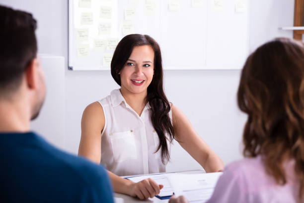 istock Businesspeople Taking Interview Of Woman 1144373697