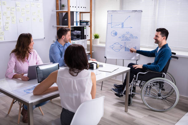 istock Disables Businessman Giving Presentation 1144373746