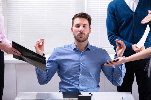 istock Young Businessman Meditating In Office 1144374083