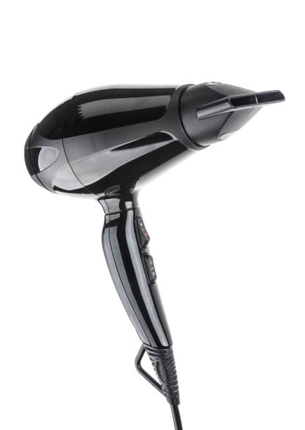 istock Black hair dryer close up on white background 1144374093
