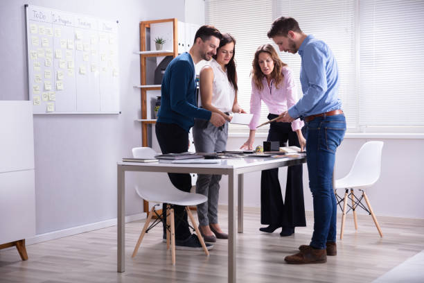 istock Businesspeople Working Together Choosing Color Palette 1144374098