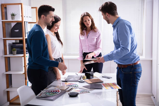 istock Businesspeople Working Together Choosing Color Palette 1144374099