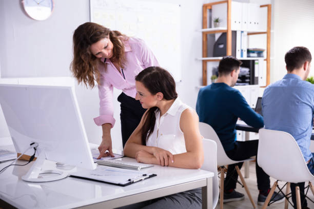 istock Businesswoman Working With Colleagues 1144374107