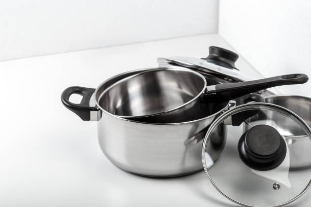 istock Stainless steel pots and pans isolated on white 1144374316
