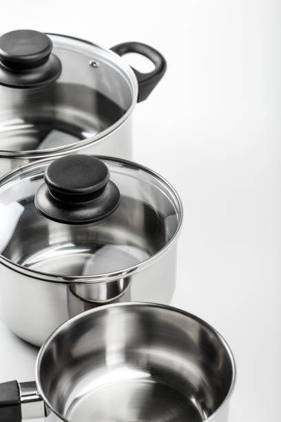 istock Stainless steel pots and pans isolated on white 1144374600