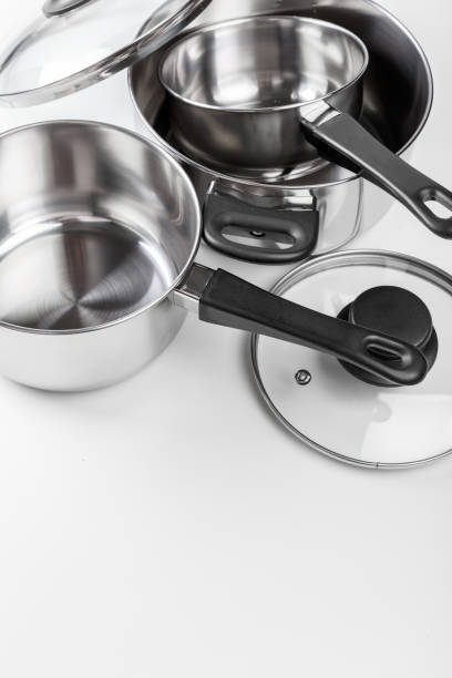 istock Stainless steel pots and pans isolated on white 1144375308