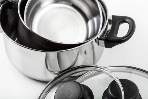 istock Stainless steel pots and pans isolated on white 1144375492