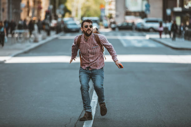 istock Young Man Walking on the City Road 1144375913