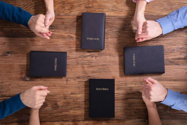 istock People Holding Each Others Hand Praying Together 1144377558