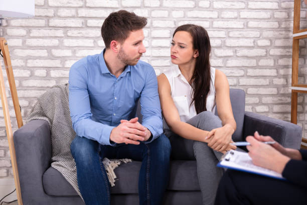 istock Female Consultant Sitting With Couple 1144377633