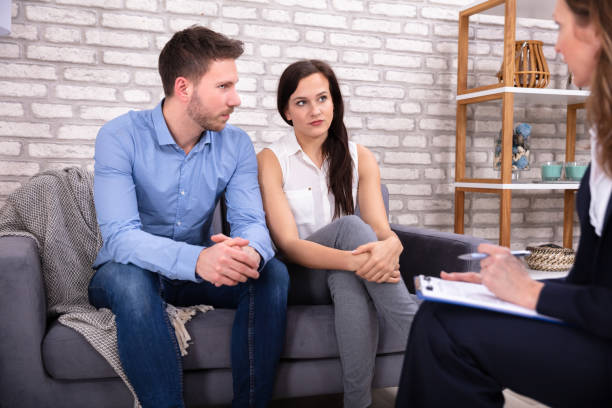 istock Female Consultant Sitting With Couple 1144377637