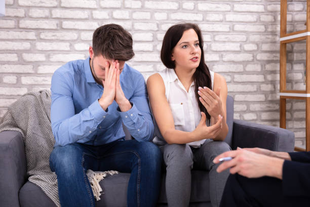 istock Young Psychologist Talking With Depressed Couple 1144377644
