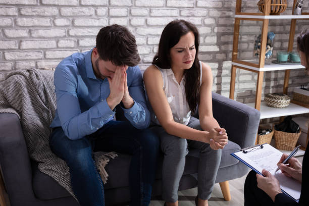 istock Young Psychologist Talking With Depressed Couple 1144377657