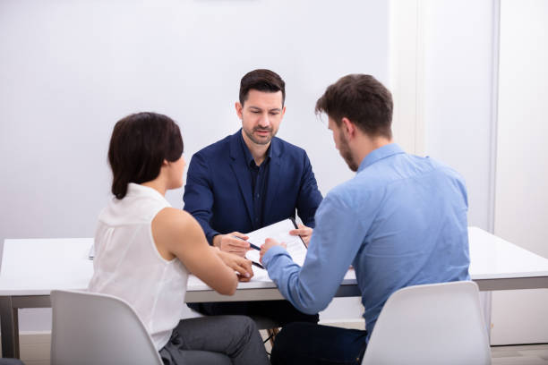 istock Couple Sitting In Front Of Judge 1144377671