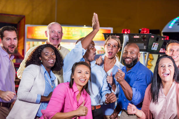 istock Corporate team building at amusement arcade 1144377769