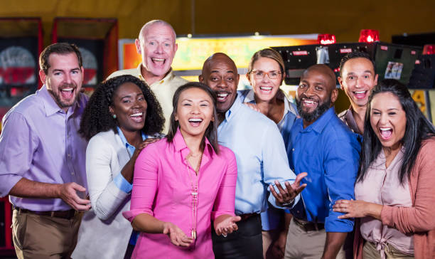 istock Corporate team building at amusement arcade 1144378366