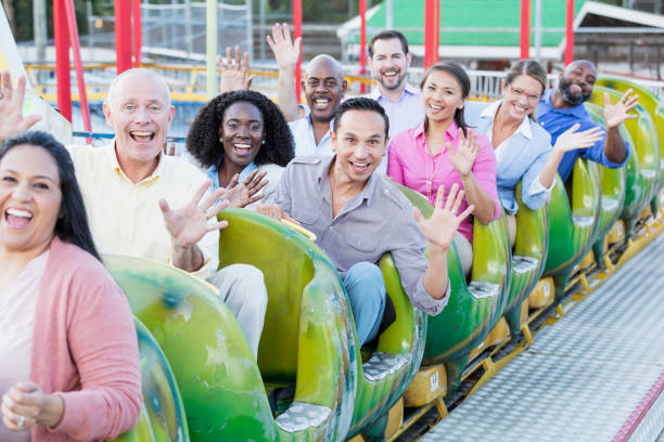 istock Corporate team building on amusement park rollercoaster 1144378540