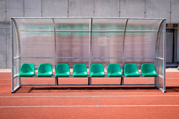 istock Coach and reserve benches in soccer stadium 1144378633