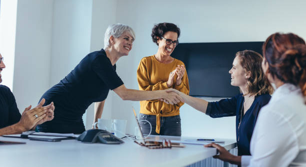 istock Team congratulating and appreciating a colleague 1144380905