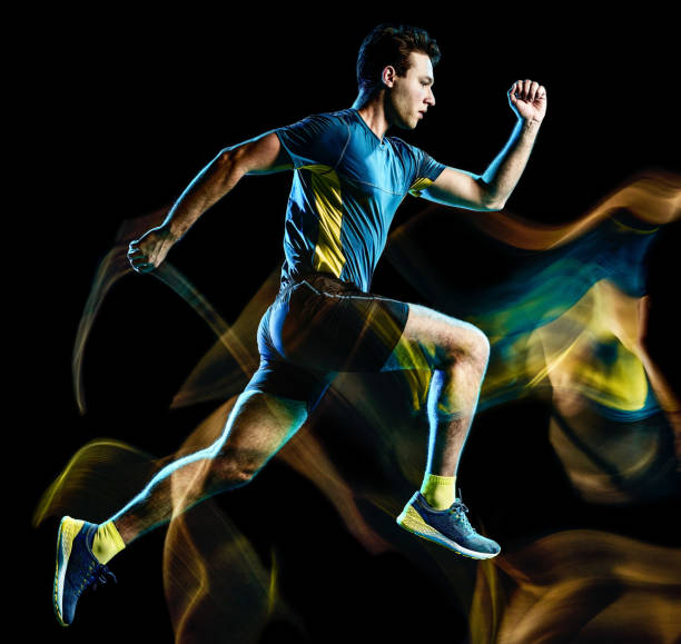 istock runner running jogger jogging man isolated light painting black background 1144382532