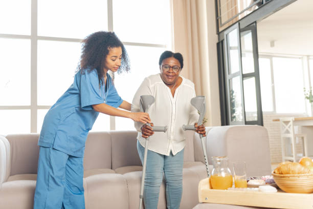 istock Woman feeling satisfied after making first steps after surgery on legs 1144384694
