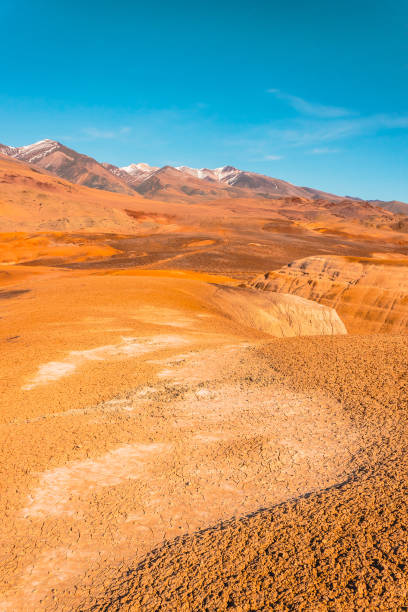 istock Yellow and red rocks under blue sky. Desert landscape with mountains. 1144384904