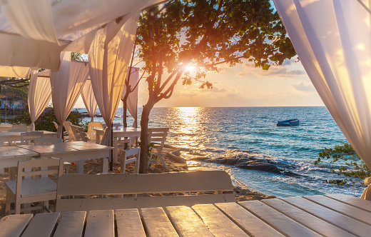 Island blue sea view with white decoration relax place with sunrise lighting.