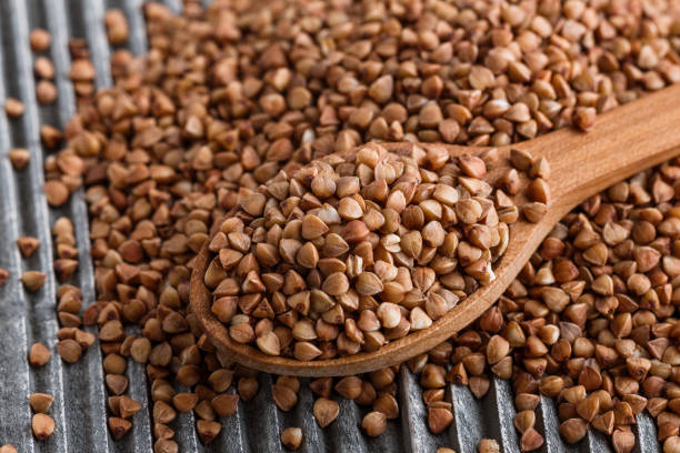 istock Grain buckwheat on a gray wooden background 1144388211