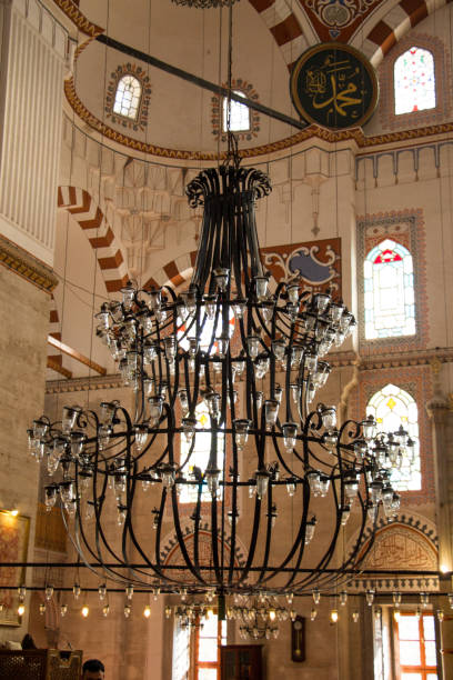 istock Bright mosque lamps on a circular chandelier 1144388279