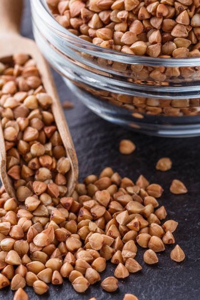 istock Grain buckwheat on a dark stone background 1144388982