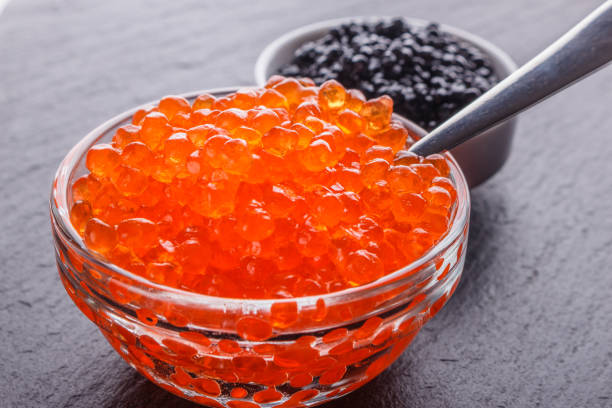 istock red and black caviar in a bowl on a dark stone background 1144390846