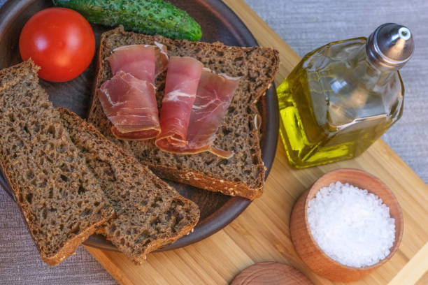 istock Snack with homemade rye bread and dried pork 1144390938