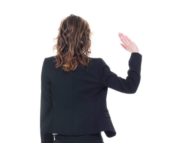 istock Caucasian businesswoman is waving while walking 1144392987