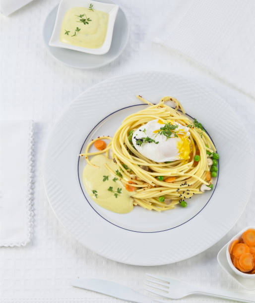 istock Egg Benedict with hollandaise sauce on spaghetti 1144393315