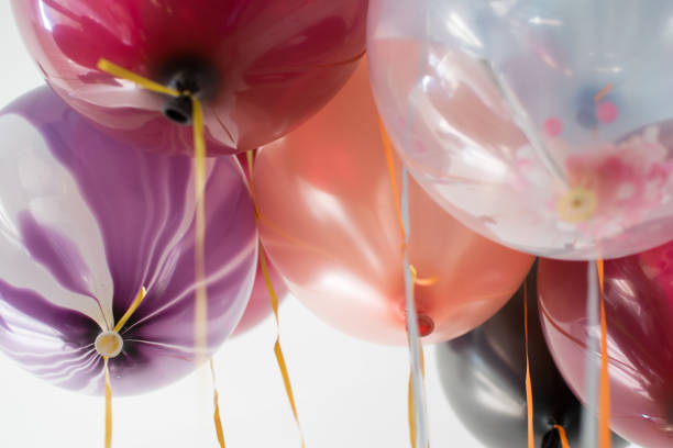 istock Multi-colored balloons in the room, white background, blurred background 1144394741