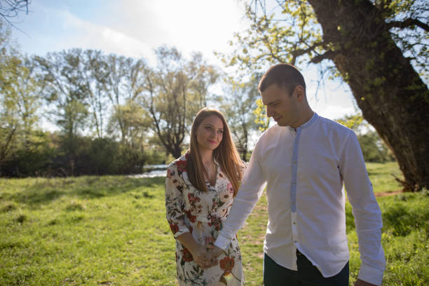 istock Young loving couple in the park 1144394862