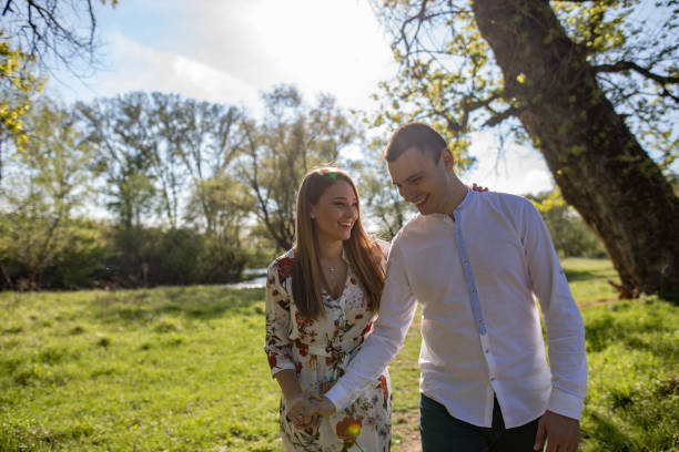 istock Young loving couple in the park 1144394882