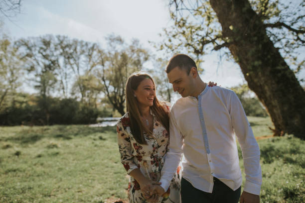 istock Young loving couple in the park 1144394896