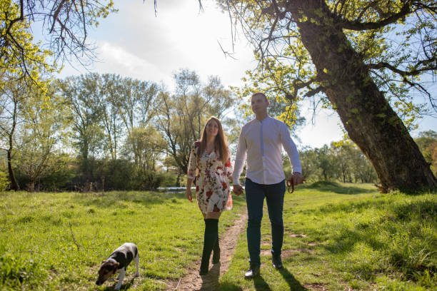 istock Young loving couple in the park 1144394897