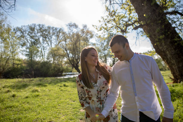 istock Young loving couple in the park 1144394986