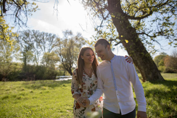 istock Young loving couple in the park 1144395027