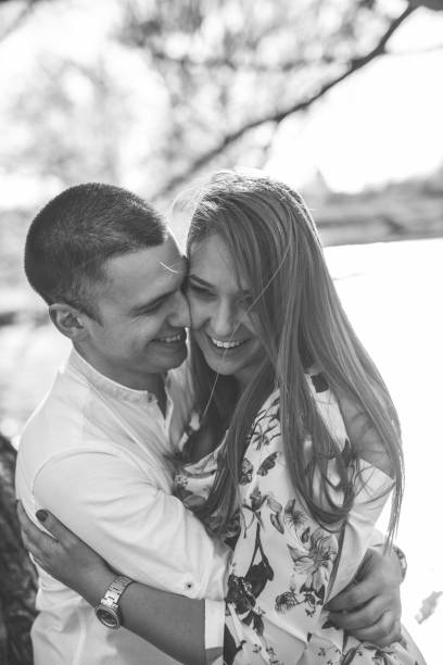 istock Young loving couple in the park 1144395999